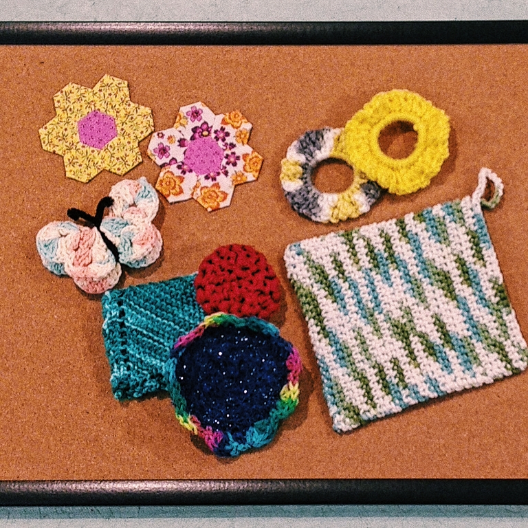 several crocheted items to represent granny crafts