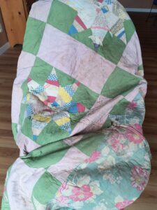 old vintage quilt in bad shape