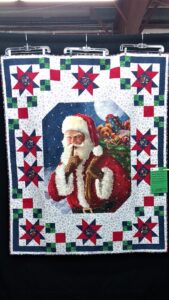 quilt pattern of Santa made into a quilt