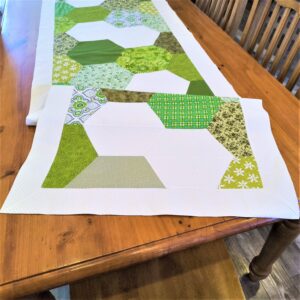 green and white hexagon table runner