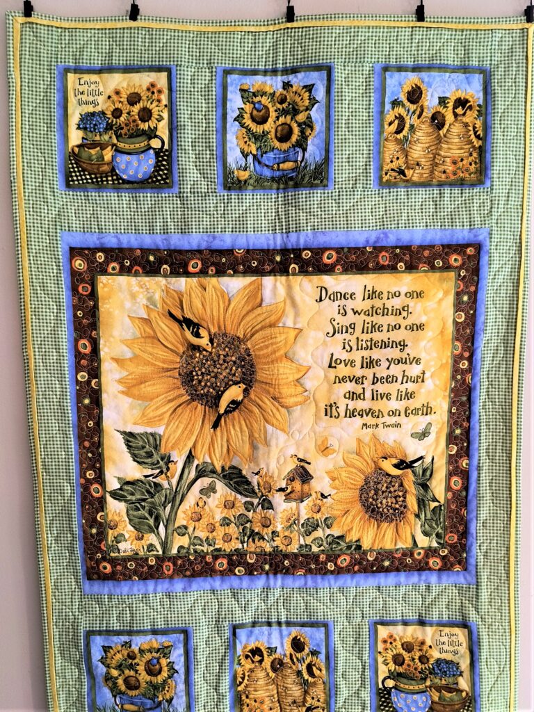 quilt panel of sunflowers made into a wall hanging