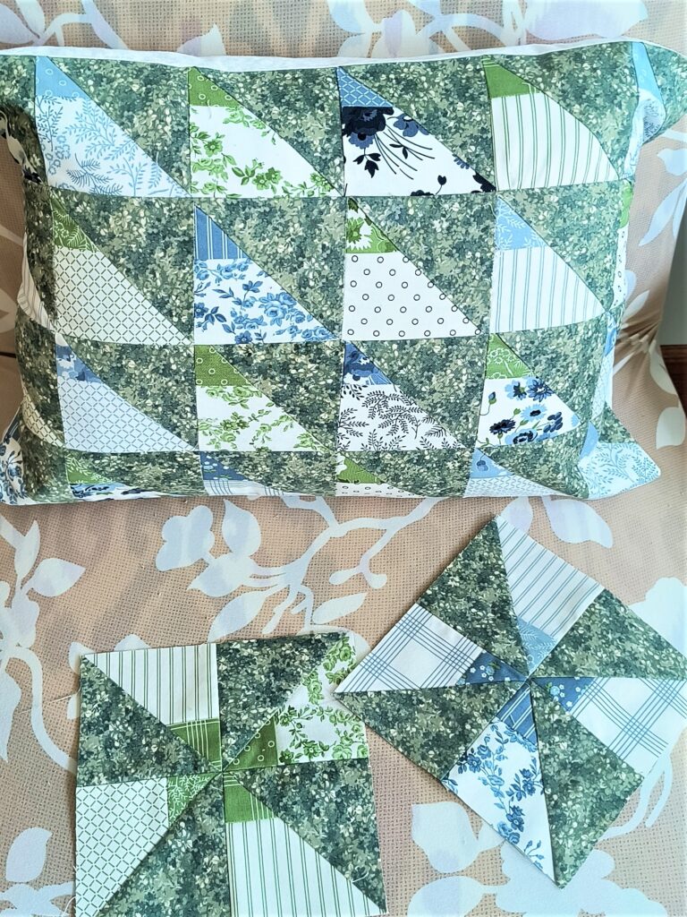 half square triangle pillow and two pinwheel blocks