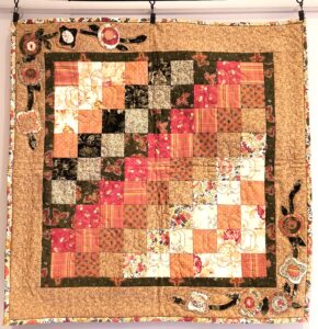 Fall colored patchwork wall hanging quilt