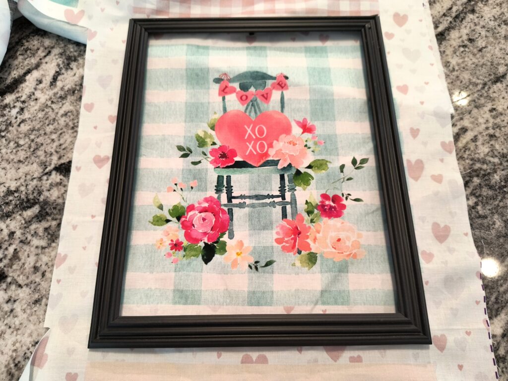 shows how to place the frame over the picture to cut.